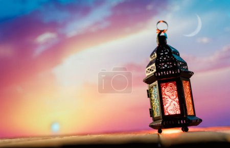 Photo for Ornamental Arabic lantern with burning candle glowing at night. Festive greeting card, invitation for Muslim holy month Ramadan Kareem. - Royalty Free Image