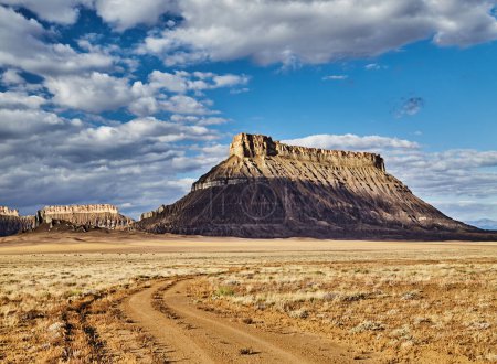 Factory Butte, isolated flat-topped sandstone mountain in Utah desert, USA