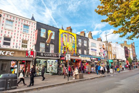 Photo for LONDON, ENGLAND - OCTOBER 17, 2022: Houses with colorful decorated facades on High Street in Camden town - Royalty Free Image