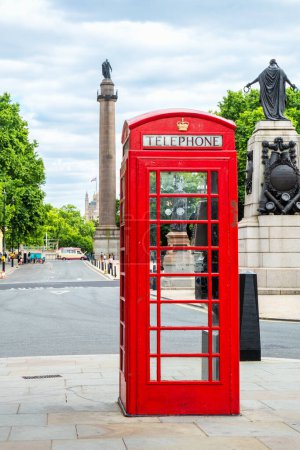 Téléchargez les photos : Red telephone booth in front of Waterloo Place square. London, England, UK. Selective focus - en image libre de droit