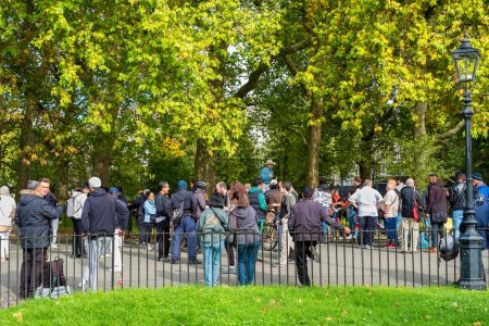 Photo for LONDON, ENGLAND - OCTOBER 16, 2022: People listen to a speaker at Speakers Corner in Hyde Park - Royalty Free Image