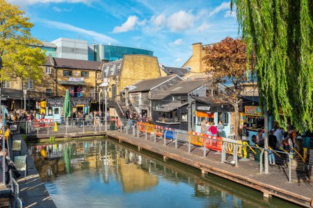 Photo for LONDON, ENGLAND - OCTOBER 17, 2022: View to basin on the Regents Canal and food stalls at Camden Market - Royalty Free Image