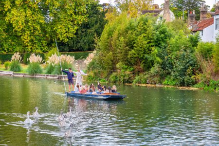 Photo for Cambridge, England - October 15, 2022: Hen party with a bride enjoying punt ride on the River Cam - Royalty Free Image