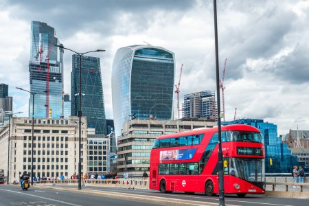 Photo for London, England - July 25, 2022: Red double decker bus crossing London Bridge - Royalty Free Image