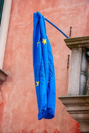 Photo for Flag of the European Union hanging limply on a house. Venice, Italy - Royalty Free Image