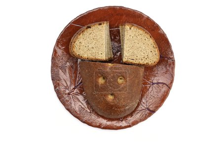 Photo for Sliced rye bread on a ceramic plate - Royalty Free Image