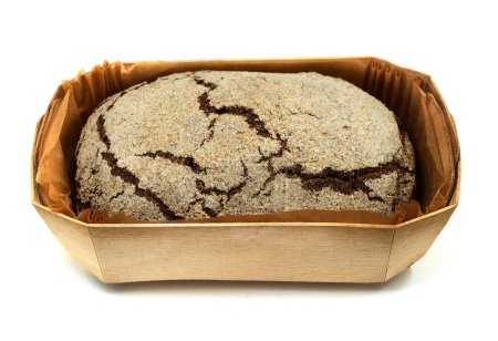 Photo for Loaf of fresh rye bread in a wooden box on a white background - Royalty Free Image