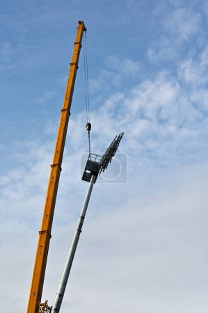 Photo for Installation of lighting equipment at the stadium with a crane - Royalty Free Image