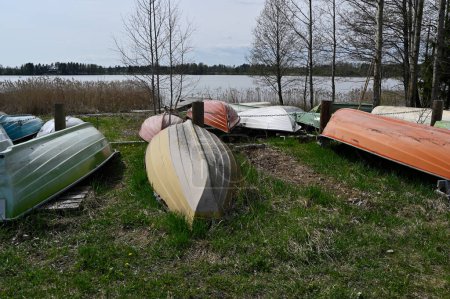 overturned boats on the lake shore in Finland 