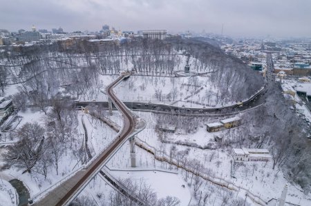 Photo for Aerial drone view. Glass bridge in Kiev in snowy weather. - Royalty Free Image