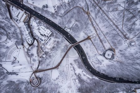 Photo for Aerial drone view. Glass bridge in Kiev in snowy weather. - Royalty Free Image