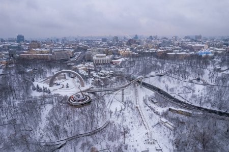 Aerial drone view. Glass bridge in Kiev in snowy weather.
