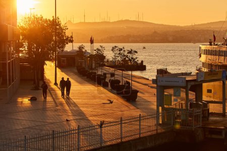 Photo for ISTANBUL, ISTANBUL - APRIL 22, 2017:People relax on the promenade of Besiktas at the Bosphorus on a sunny day, Turkey. - Royalty Free Image