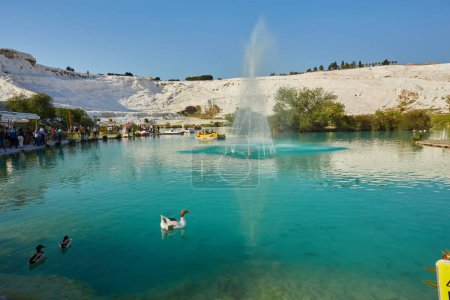 Photo for April 29, 2017, Pamukkale, Denizli, Turkey, Lake with green water, calcified limestone terraces on background. Pamukkale, Turkey. - Royalty Free Image