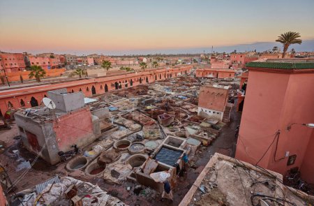 Photo for Workers inside traditional tannery in Marrakesh, Morocco - Royalty Free Image