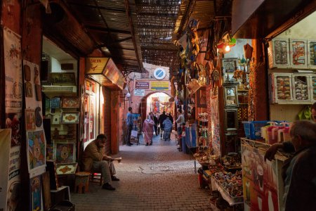 Foto de Morocco, Marrakech, February 02, 2017: View of the market and cafe place in the medina of Marrakesh on a sunny day. - Imagen libre de derechos