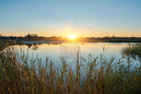 Photo for Scenic view of beautiful sunset or sunrise above the river at summer evening. - Royalty Free Image