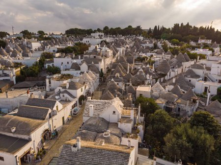 Photo for Aerial view of Alberobello, city of Trulli in Itria Valley, Puglia. Traditional Apulian dry stone huts with a conical roof in the Murge area of the Italian region of Apulia. Trulli city in south Italy - Royalty Free Image