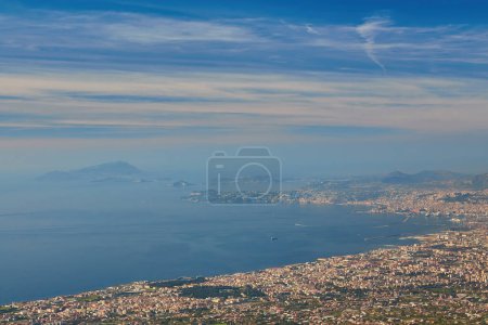 Photo for Panoramic view from volcano Mount Vesuvius on the bay of Naples, Province of Naples, Campania region, Italy, Europe, EU. Looking at the island of Capri and Mediterranean coastline on a cloudy day. - Royalty Free Image