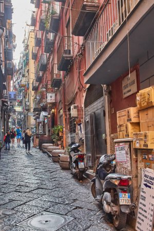 Photo for Naples, Italy - October 24, 2019: View of a crowded street Via Toledo with the shops, cafe, souvenir shops in the historical center in Naples - Royalty Free Image