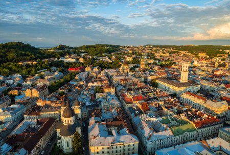 Photo for Rooftops of the old town in Lviv in Ukraine during the day. The magical atmosphere of the European city. Landmark, the city hall and the main square. Drone photo. - Royalty Free Image