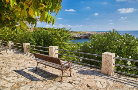 Photo for Bench overlooking the Mediterranean coast, Italy - Royalty Free Image