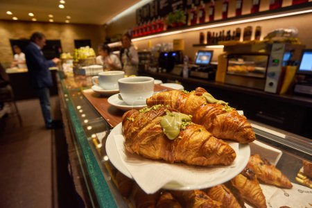 Photo for Assortment of freshly baked croissants for sale on counter of shop, market, cafe or bakery. Dessert, pastry, breakfast, sweet food and traditional french cuisine concept - Royalty Free Image