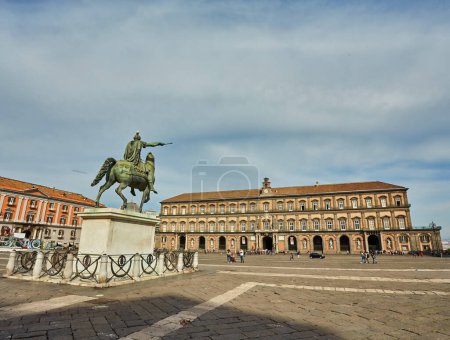 Photo for Naples, Italy - October 24, 2019: Naples, Italy, view of city main square Piazza del Plebiscito with Basilica Reale Pontificia San Francesco da Paola church and the bronze statue of king Ferdinand I of Bourbon on horse on sunrise - Royalty Free Image