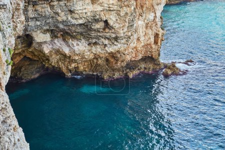 Photo for Polignano a Mare seen from the sea. Cliffs and caves - Royalty Free Image