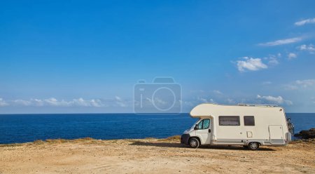 Photo for Camper rv caravan on mediterranean coast in Apulia, Italy. Wild camping on sea shore. Holidays and travel in motor home. - Royalty Free Image