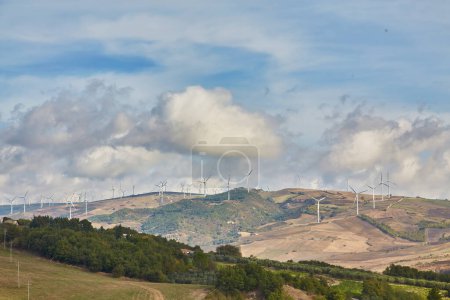 Photo for Highways of southern Italy Puglia with the landscape of hills, fields and wind turbines. - Royalty Free Image