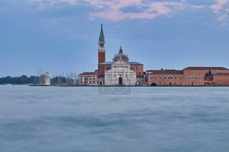 Photo for Scenic view of St George Church and Island in the Giudecca Canal, as seen at night from St Mark's district in Venice, Italy - Royalty Free Image