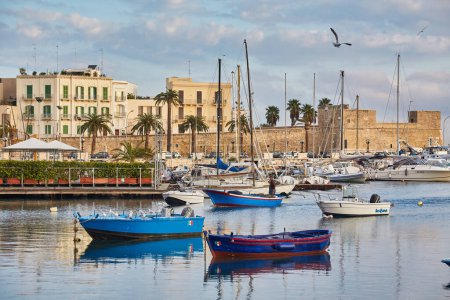 Photo for Bari town skyline and fishing boats - harbor in Apulia region, Italy. - Royalty Free Image