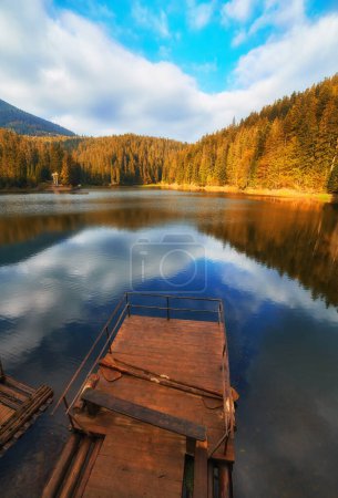 Photo for Carpathian Mountains during autumn. The captivating Synevir Lake reflects the vibrant colors of the surrounding foliage. - Royalty Free Image