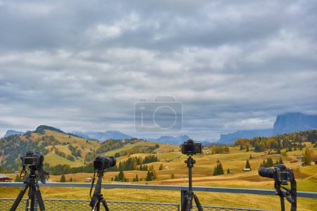 Photo for Several cameras are on tripods. Shooting a mountain landscape in the Dolomites, Italy, Europe - Royalty Free Image