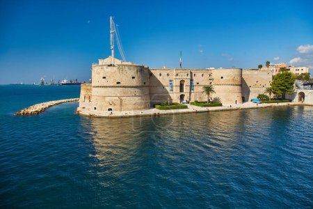 Photo for Aragonese Castle of Taranto and revolving bridge on the channel between Big and Small sea, Puglia, Italy, Blue sunny sky - Royalty Free Image