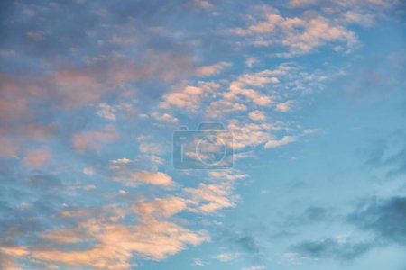 Photo for A breathtaking sunset scene with colorful hues painting the sky. Billowing clouds create a stunning backdrop, evoking a sense of tranquility and wonder, natural background - Royalty Free Image