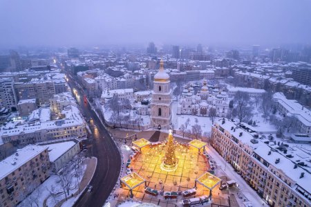 Photo for Christmas tree with lights outdoors at night in Kiev. Sophia Cathedral on background. New Year Celebration - Royalty Free Image