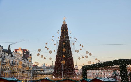 Photo for Christmas tree with lights outdoors at night in Kiev. Sophia Cathedral on background. New Year Celebration - Royalty Free Image