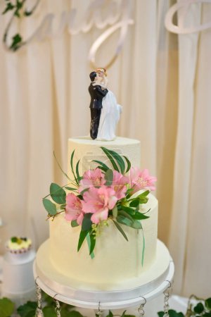 Photo for Traditional and decorative wedding cake at wedding reception. - Royalty Free Image