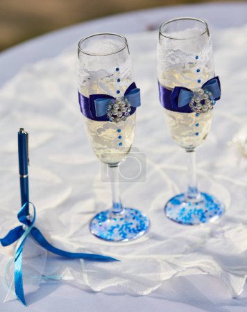 Photo for Glasses of champagne candels and dryed raisins - Royalty Free Image