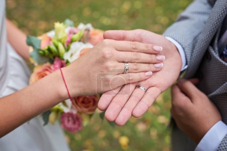 Photo for Newly wed couple's hands with wedding rings - Royalty Free Image