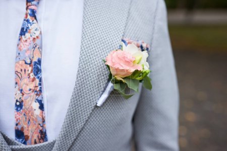 Photo for Elegant boutonniere of white roses and eucalyptus leaves - Royalty Free Image