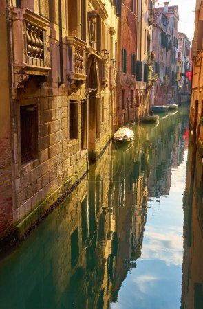 Photo for Beautiful narrow canal with silky water in Venice, Italy - Royalty Free Image