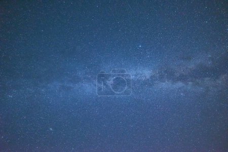 Photo for Get lost in the beauty of the Milky Way with this stunning photograph. The night sky is filled with stars and constellations, making it a perfect background for any project. Use it as a backdrop for your designs or marketing materials and add a touch - Royalty Free Image