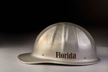 Photo for Florida jobs hard hat on black background with room for your type. - Royalty Free Image
