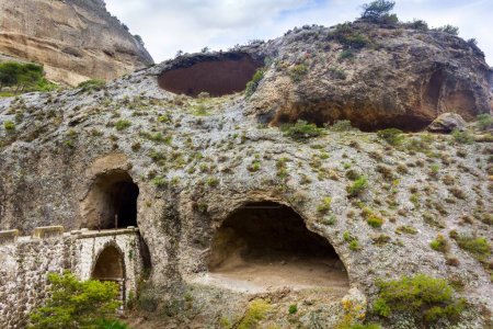 Cave with entrance bridge to El Caminito del Rey in El Chorro Spain