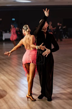 Photo for A couple dance a Latin dance. the legs of a dancing couple - Royalty Free Image