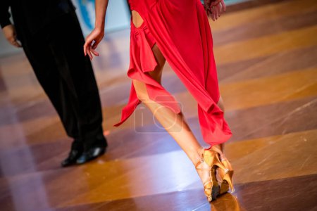Photo for The couple dance a Latin dance. the legs of a dancing couple - Royalty Free Image