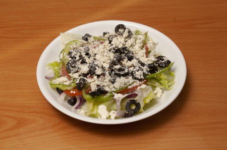 Photo for Delicious and authentic Italian cuisine known as a greek salad - Royalty Free Image
